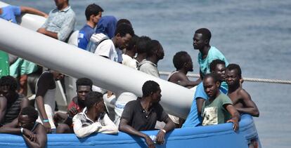 Rescued migrants wait to disembark in Catania, Italy.