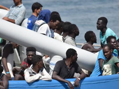 Rescued migrants wait to disembark in Catania, Italy.