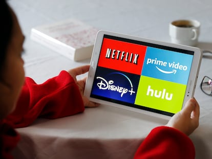 Various streaming platforms are seen on a tablet.