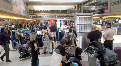 Travelers make their way through the Tom Bradley International Terminal at LAX