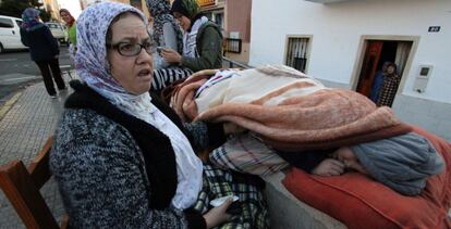 Fadma Abdeselam with her son outside their home in Melilla.