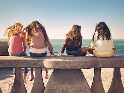 Teen girls, and pre teen sisters enjoying together on a beautiful sunny day.