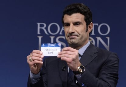 Former Barcelona and Real Madrid midfielder Luis Figo plucks the Catalan club out of the tombola at the Uefa draw ceremony on Monday. 