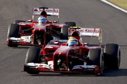 Felipe Massa (front) and Fernando Alonso joust during the Japanese Grand Prix.  