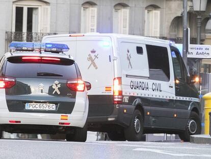 Police vehicles arrive at the Supreme Court in Madrid.