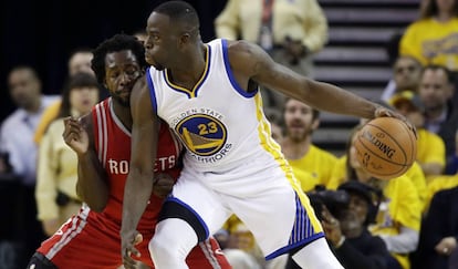 Draymond Green y Patrick Beverley.