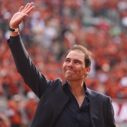 Rafa Nadal waves to the crowd during a farewell ceremony at center court Philippe-Chatrier, at the Roland-Garros stadium, in Paris, Sunday May 25, 2025. (AP Photo/Lindsey Wasson)