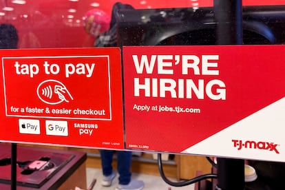 A hiring sign is displayed at a retail store in Mount Prospect, Ill., Friday, Jan. 13, 2023.