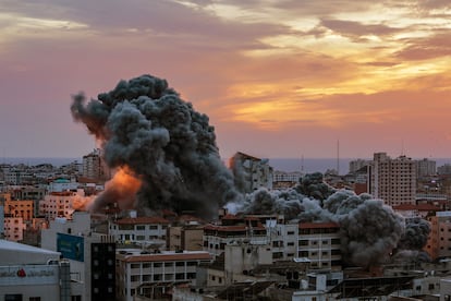 Smoke rises after Israeli warplanes targeted the Palestine tower in Gaza City, 07 October 2023.