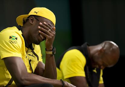 Usain Bolt riéndose junto a su compatriota Asafa Powell.