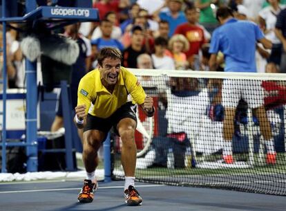 Tommy Robredo celebrates his straight sets victory over Roger Federer on Monday. 