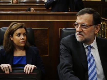 De izquierda a derecha, Alberto Ruiz-Gallardón, Soraya Sáenz de Santamaría y Mariano Rajoy.