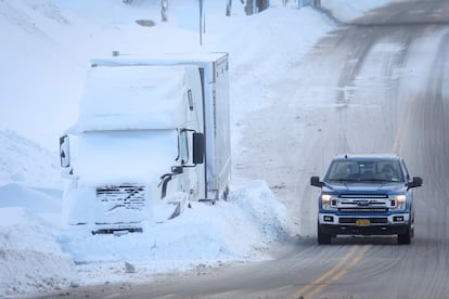 Vehicles are left stranded on the road following the winter storm that hit the Buffalo region in Amherst, New York, US, December 25, 2022.  