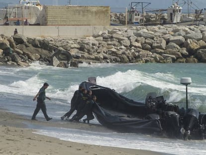 Civil guards push a speedboat used by drug gangs in the Strait of Gibraltar.