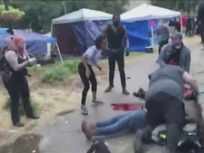 SENSITIVE MATERIAL. THIS IMAGE MAY OFFEND OR DISTURB People come to the aid of a victim bleeding on the ground after a fatal shooting at Jefferson Square Park, in Louisville, Kentucky, U.S., June 27, 2020 in this still image obtained from social media video. Protesters have camped out at the park to demonstrate against the police killing of Breonna Taylor, a Black woman, in her home in March. Content filmed June 27, 2020. Maxwell Mitchell via REUTERS THIS IMAGE HAS BEEN SUPPLIED BY A THIRD PARTY. MANDATORY CREDIT