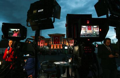 Journalists work outside presidential palace as they wait for Turkish President and People's Alliance's presidential candidate Recep Tayyip Erdogan during the election day, in Ankara, Turkey