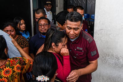 A woman cries as she hugs a deported relative at the gate of the Guatemalan Air Force (FAG) airport, in Guatemala City, on May 25.