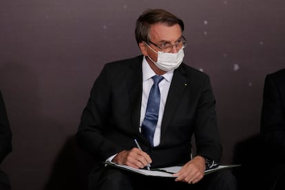 El presidente Bolsonaro, este martes durante la firma en Brasilia de un acuerdo de cooperación entre la NASA y su Gobierno.