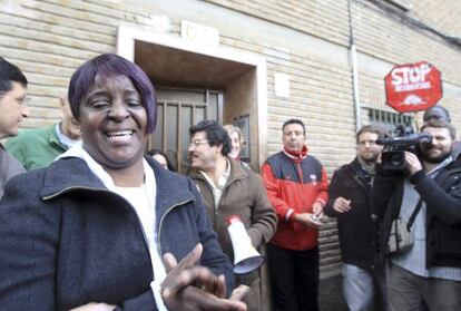 A woman bursts into tears after an eviction against her is stopped in Zaragoza Thursday. 