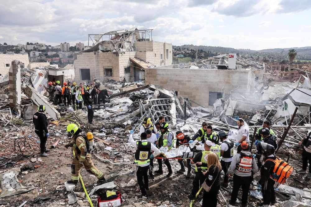 Emergency response teams attend the scene of a fatal Iranian strike, after Iran launched missile barrages following attacks by the U.S. and Israel on Saturday, in Beit Shemesh, Israel March 1, 2026. REUTERS/Ammar Awad    ISRAEL OUT. NO COMMERCIAL OR EDITORIAL SALES IN ISRAEL     TPX IMAGES OF THE DAY     