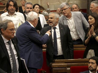 Angry scenes between lawmakers inside the Catalan parliament on Thursday.