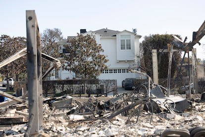 An intact home in the middle of the destruction caused by the Palisades Fire.