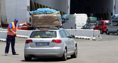 Cars line up to board a ferry in Algeciras.