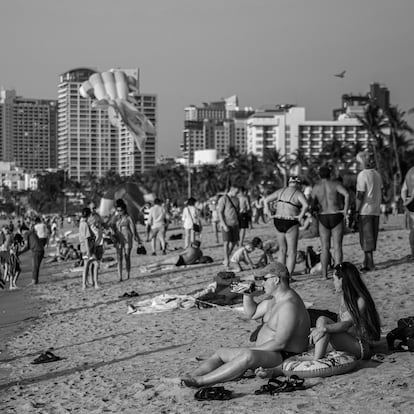 PATTAYA, THAILAND - FEBRUARY 26: Tourists visit Central Pattaya Beach during the International Kite on the Beach Festival on February 26, 2023 in Pattaya, Thailand. Pattaya hosts the 'International Kite on the Beach' festival on Central Pattaya Beach from February 24-28. Showcasing several giant kites, the festival hopes to draw tourists now that global travel is recovering. Tourism operators are predicting approximately 20 million tourists to visit Thailand in 2023. Beginning in June, a new Thai law requires all international tourists pay a 300 baht ($8.59 USD) fee upon arrival. (Photo by Lauren DeCicca/Getty Images)