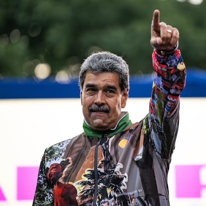 CARACAS, VENEZUELA - JULY 18: President of Venezuela Nicolas Maduro rises his hand during a mass gathering convene by supporters on July 18, 2024 in Caracas, Venezuela. Venezuela will hold the presidential election on July 28 where the incumbent Nicolas Maduro seeks the re-election for second time against opposition candidate Edmundo Gonzalez Urrutia for the Plataforma Unitaria coalition. (Photo by Alfredo Lasry/Getty Images)