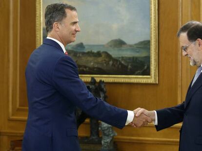 King Felipe greets Mariano Rajoy in July.