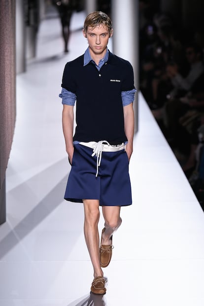 Troye Silvan walks in last spring’s Miu Miu runway show, dressed as a young ‘finance bro.’