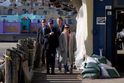 President Joe Biden walks on the boardwalk with Jill Ealy and California Gov. Gavin Newsom as he visits with business owners and local residents in Capitola, Calif., Thursday, Jan 19, 2023, to survey recovery efforts following a series of severe storms.