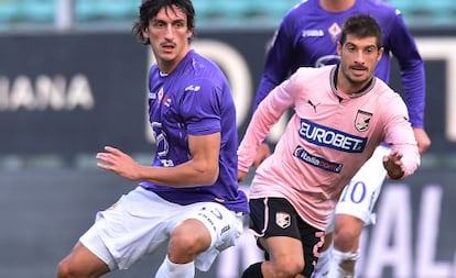 Los jugadores Franco Brienza y Stefan Savic.