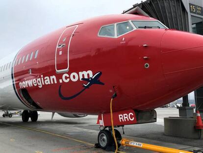 FILE PHOTO: A Norwegian Air plane is refuelled at Oslo Gardermoen airport