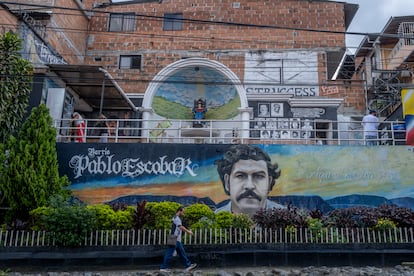 Tourists walk the streets of the Pablo Escobar neighborhood in Medellín, in 2023.