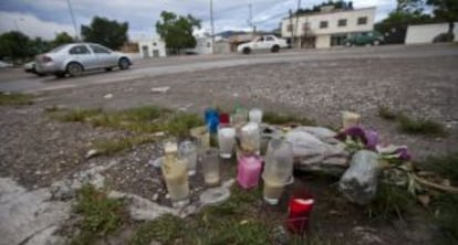 Candles in memory of the victims killed during clashes in Iguala.