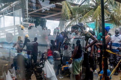 Migrants wait in Necoclí dock. The 2018 earthquake in Haiti forced many people to leave the country.