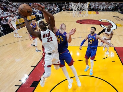 Jimmy Butler (Miami Heat) goes to the basket against Nikola Jokic (Denver Nuggets) on Wednesday in Miami, in Game 3 of the NBA Finals.