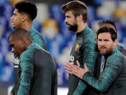 Messi y Piqué, en el estadio San Paolo.