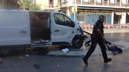 <strong>The attack on Las Ramblas in Barcelona. </strong> The van, driven by Younes Abouyaqoub, is seen above after it mowed down dozens of people on its 700-meter journey through the pedestrian boulevard. The vehicle stopped once the deployed airbag impeded the driver from continuing.