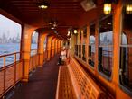 A commuter enjoys the sunset alone on the upper deck of a Staten Island Ferry during the outbreak of the coronavirus disease (COVID-19) in Manhattan, New York City, U.S., March 26, 2020.