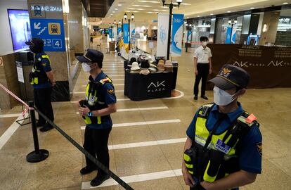 Police officers cordon off the scene near a subway station in Seongnam, South Korea