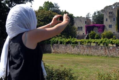 A visitor takes a photo of the Pazo de Meirás, the former summer home of Francisco Franco.