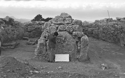 An archaeologist prepares for the stones of one of the walls of the sanctuary to be transferred. 