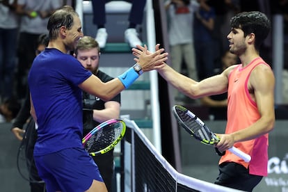 RIYADH, SAUDI ARABIA - OCTOBER 17: Carlos Alcaraz (R) of Spain celebrates winning and shakes hands after his Semi Final match against Rafael Nadal of Spain during day two of the Six Kings Slam 2024 at Kingdom Arena on October 17, 2024 in Riyadh, Saudi Arabia. (Photo by Richard Pelham/Getty Images)
