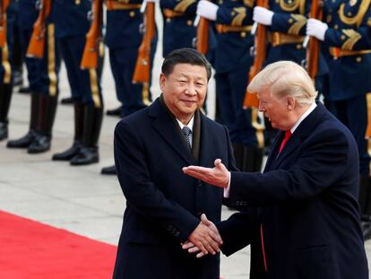 El presidente de China, Xi Jinping, con Donald Trump, presidente de EE UU.