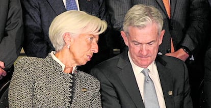 El presidente de la Fed Jerome Powell en julio de 2018 junto a Chirstine Lagarde.  