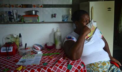 A resident of La Chinita cries as she listens to news of the peace agreement on June 22.