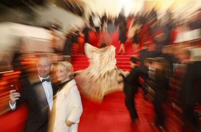 Guests take a selfie with a mobile phone on the red carpet during arrivals for the screening of the film "Coming Home" out of competition at the 67th Cannes Film Festival in Cannes