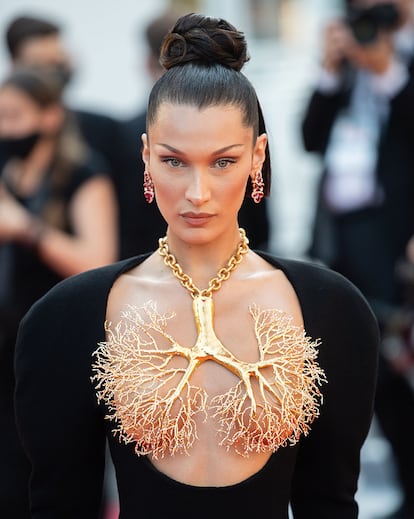 Bella Hadid at the Cannes festival with a Schiaparelli nipple necklace.
